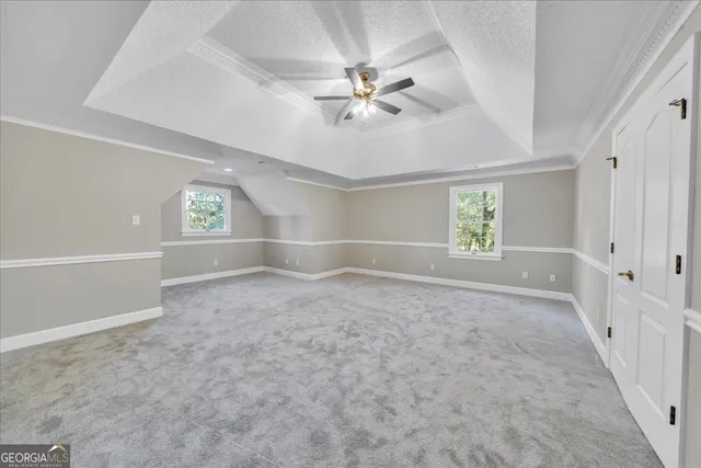 a large bathroom with a large tub and sink