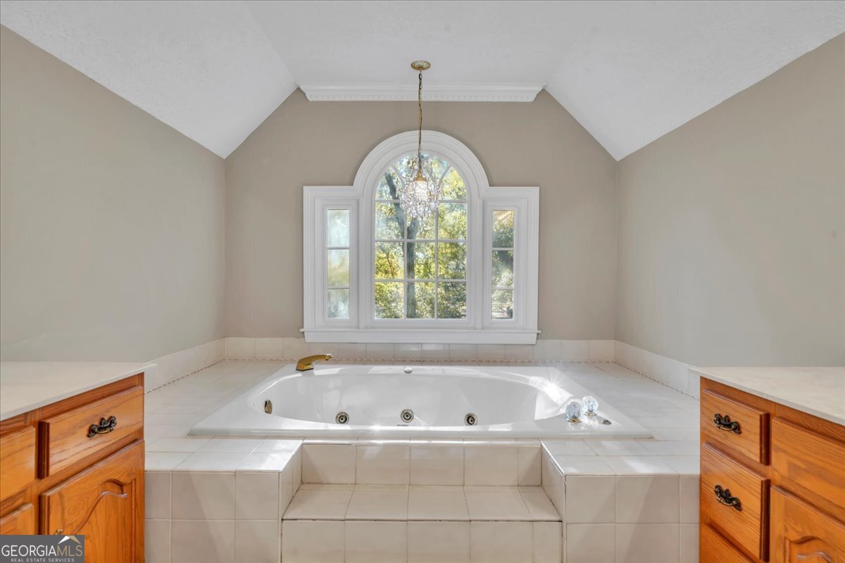 1015 Cherokee Road Perry, GA 31069 - Photo 29 of 71 a bath tub sitting in a bathroom next to a window