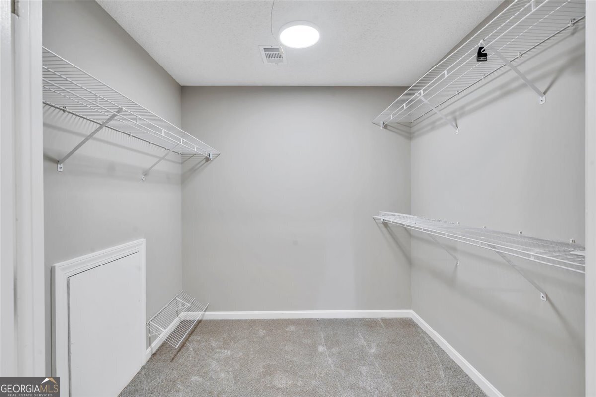 1015 Cherokee Road Perry, GA 31069 - Photo 34 of 71 a view of a room with racks on the wall