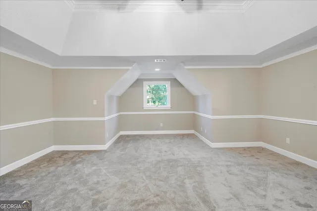 a view of a patio with table and chairs potted plants and large tree