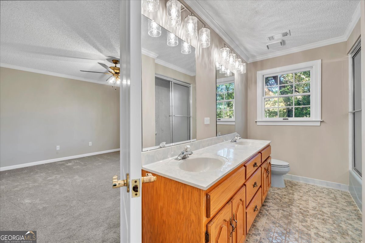 1015 Cherokee Road Perry, GA 31069 - Photo 40 of 71 a bathroom with a sink vanity and a mirror