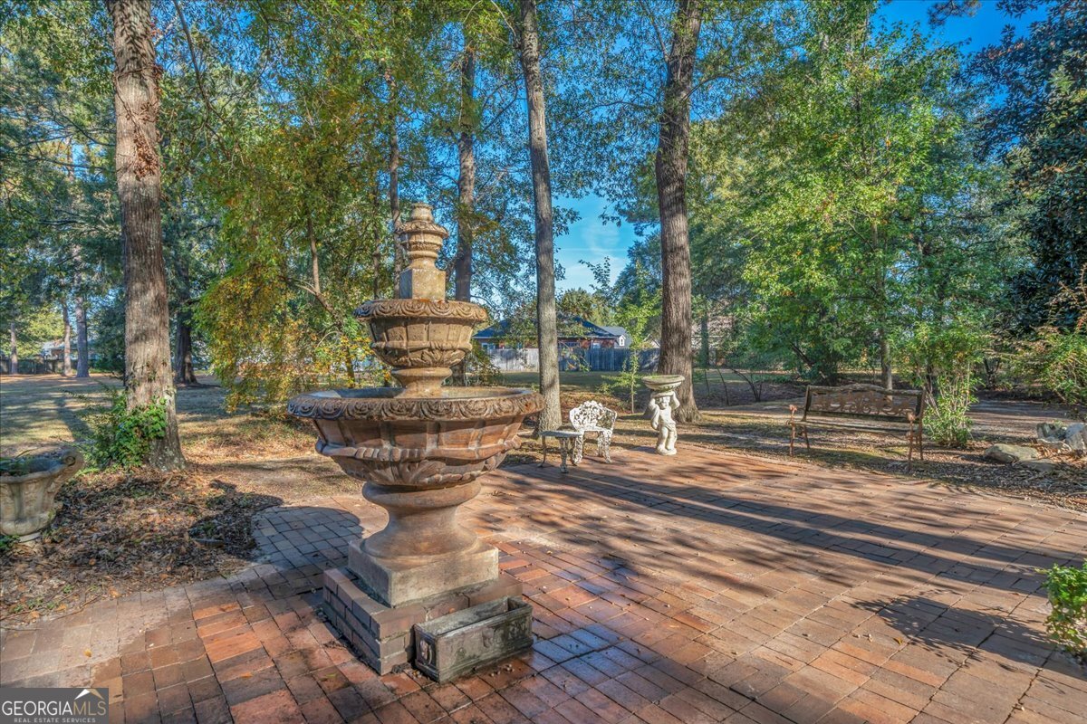 1015 Cherokee Road Perry, GA 31069 - Photo 48 of 71 a water fountain in the middle of a yard