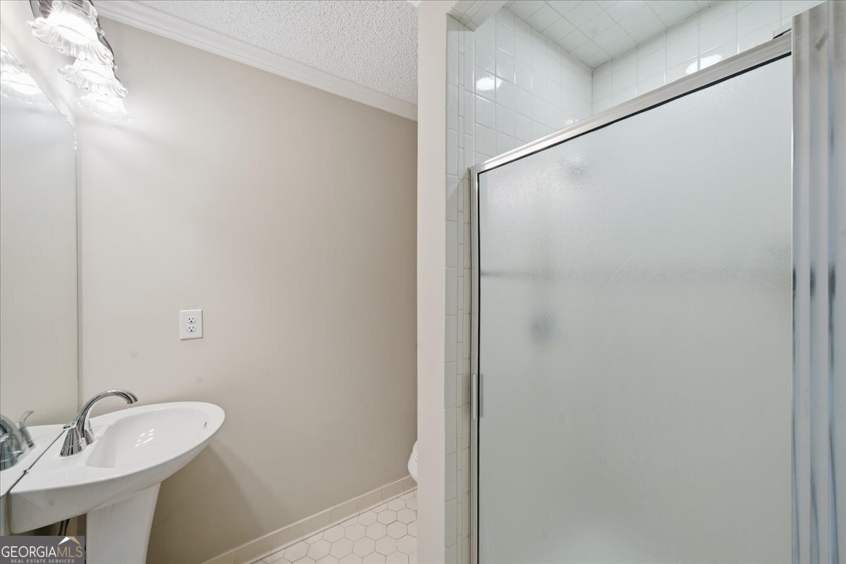 1015 Cherokee Road Perry, GA 31069 - Photo 65 of 71 a bathroom with a sink and a mirror