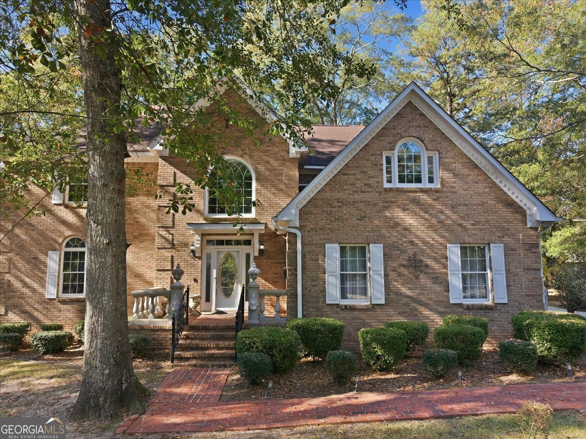 1015 Cherokee Road Perry, GA 31069 - Photo 67 of 71 a front view of a house with garden