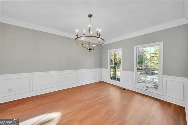 a kitchen with kitchen island a sink stainless steel appliances and cabinets