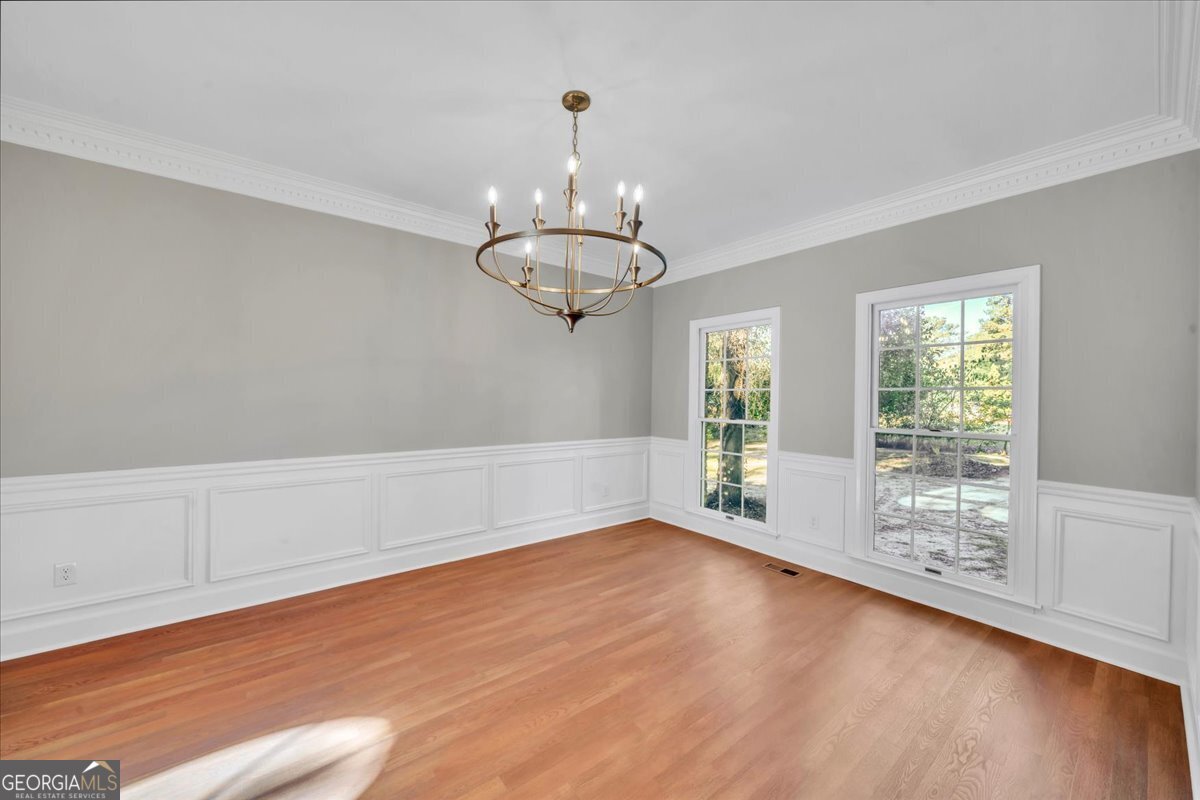 1015 Cherokee Road Perry, GA 31069 - Photo 10 of 71 wooden floor in an empty room with a window