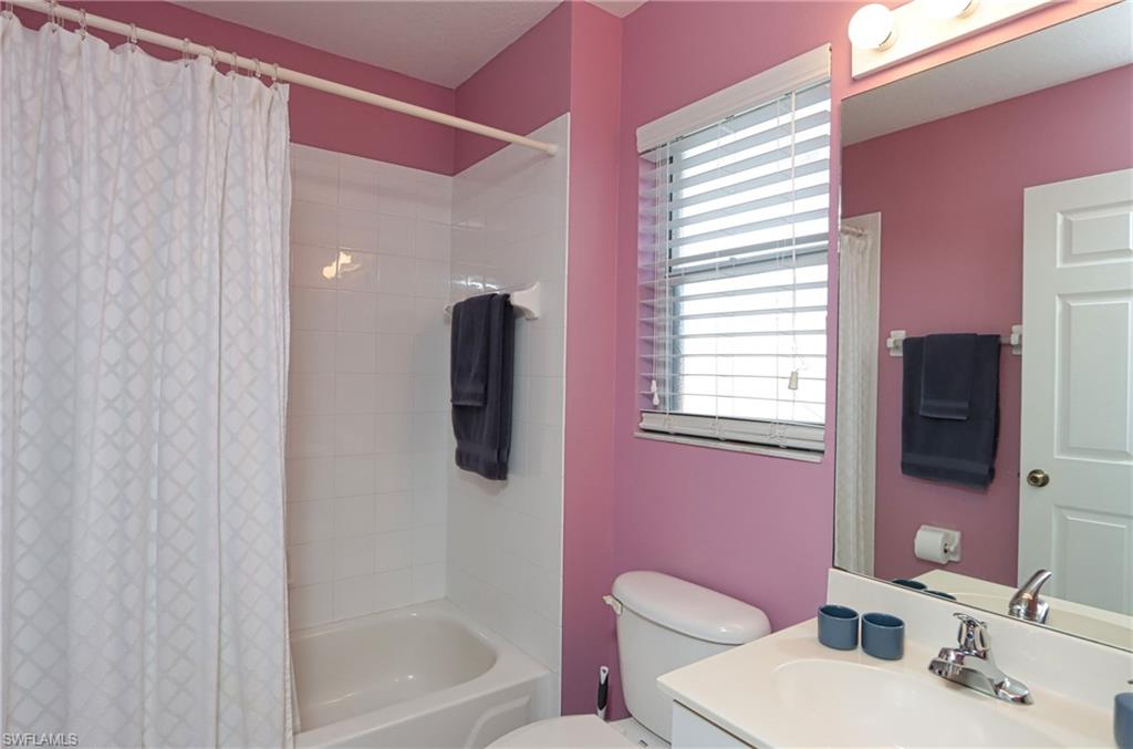 6544 Huntington Lakes Circle, Unit 9204 Naples, FL 34119 - Photo 17 of 31 a bathroom with a sink toilet and shower