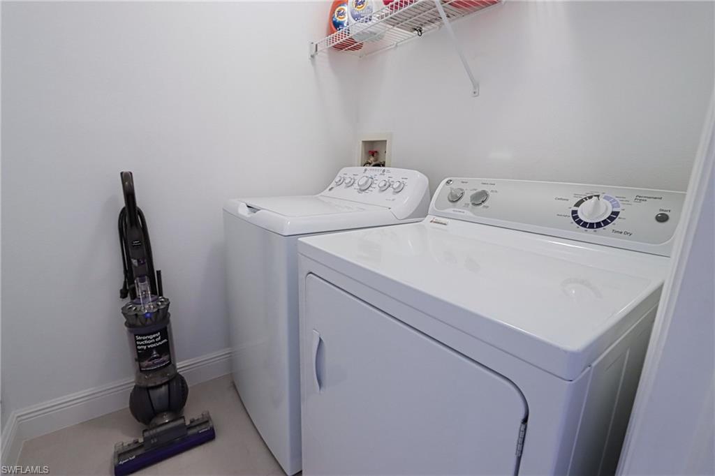 6544 Huntington Lakes Circle, Unit 9204 Naples, FL 34119 - Photo 20 of 31 a utility room with dryer and washer