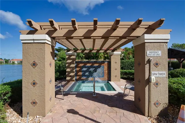 a living room with furniture a rug and a book shelf