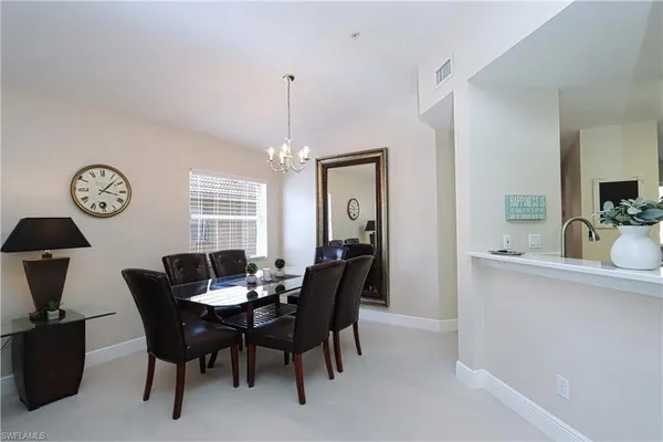 a kitchen with cabinets appliances a sink and a counter top