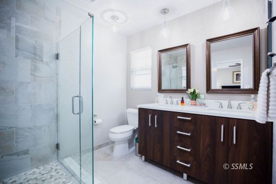 500 Scott Street Ridgecrest, CA 93555 - Photo 29 of 37 a bathroom with a double vanity sink mirror and toilet