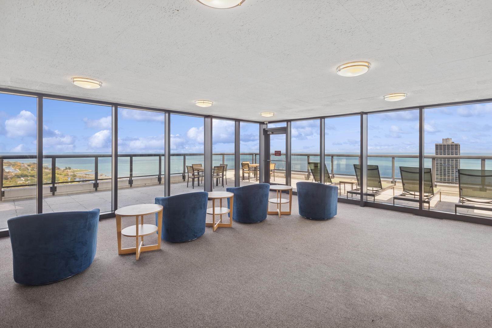 1560 North Sandburg Terrace, Unit 1412 Chicago, IL 60610 - Photo 16 of 16 a living room with furniture and a large window