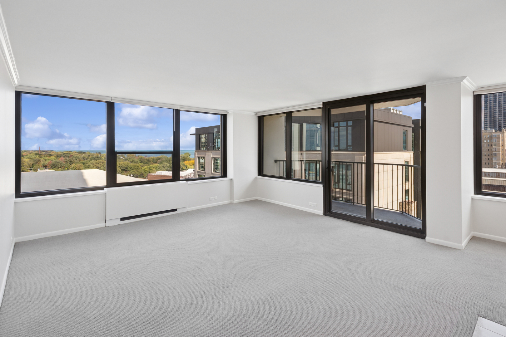1560 North Sandburg Terrace, Unit 1412 Chicago, IL 60610 - Photo 2 of 16 a view of an empty room with a large window