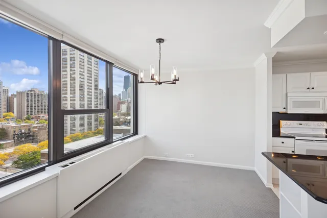 a view of a kitchen with appliances and cabinets