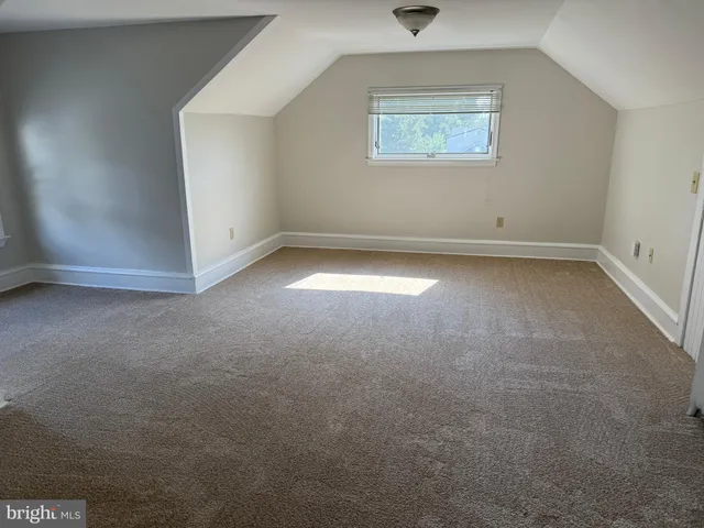 an empty room with a empty space and window