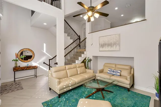a view of living room with furniture and a flat screen tv
