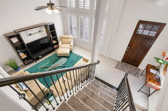 a open kitchen with stainless steel appliances granite countertop a stove top oven a sink dishwasher a dining table and chairs with wooden floor