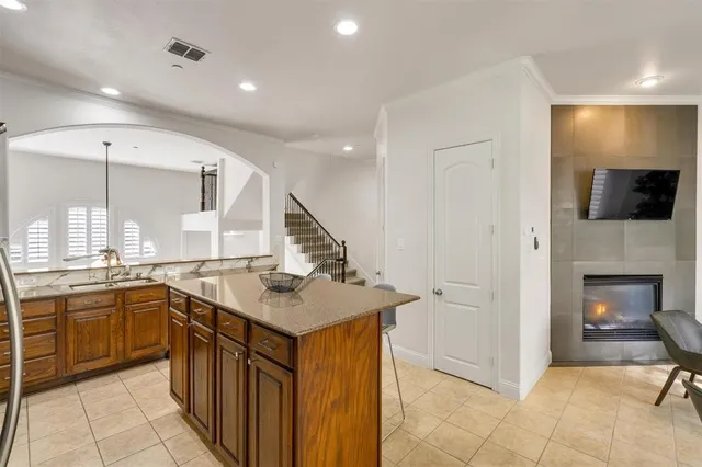 a kitchen with a sink and a mirror