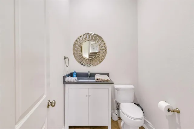a bedroom with bed and a chandelier