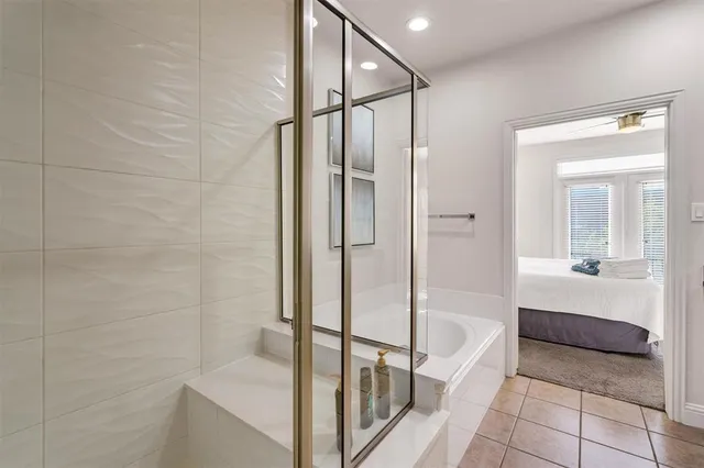 a living room with a mirror and furniture