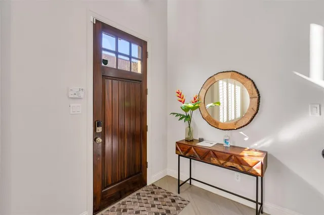 a kitchen with stainless steel appliances kitchen island granite countertop a sink and cabinets