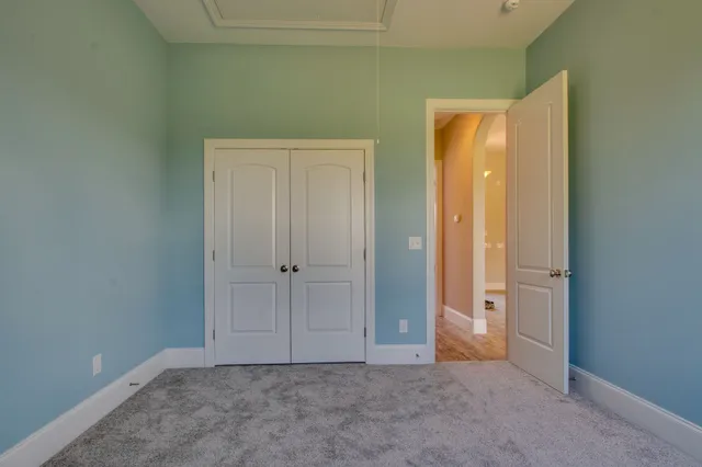 an empty room with closet area