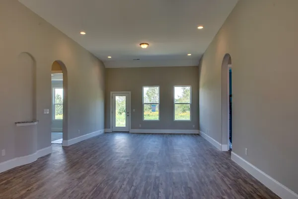 a view of livingroom with window and wooden floor