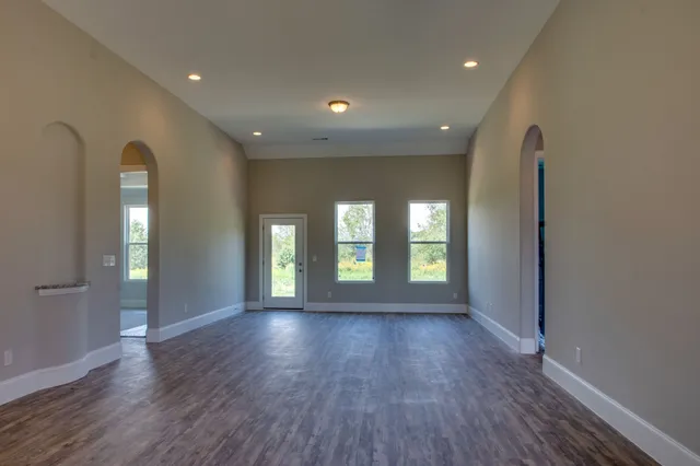 a view of livingroom with window and wooden floor