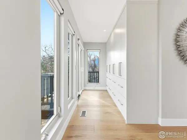 a view of a hallway with windows