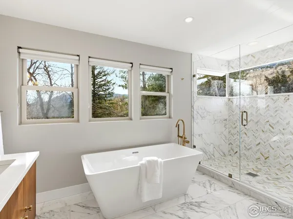 a bathroom with a bathtub and shower