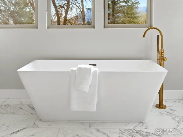 a white bath tub sitting in a bathroom