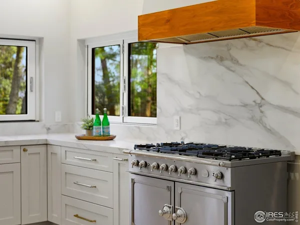 a kitchen with a stove and a window