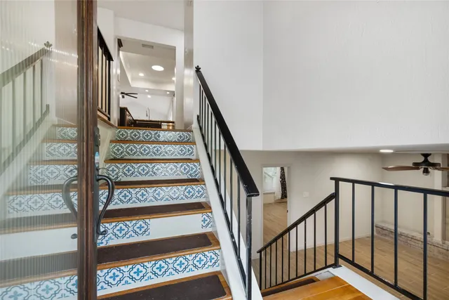a view of staircase with wooden floor and a stairs