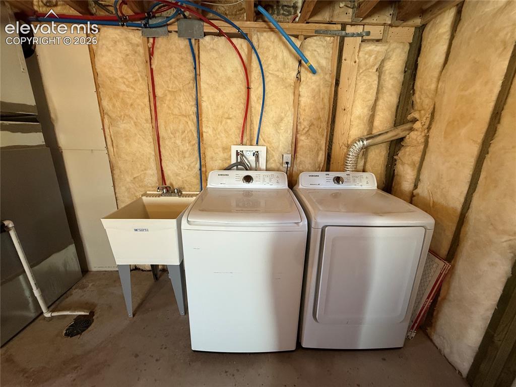 61 Stripling Lane Divide, CO 80814 - Photo 24 of 40 a utility room with dryer and washer