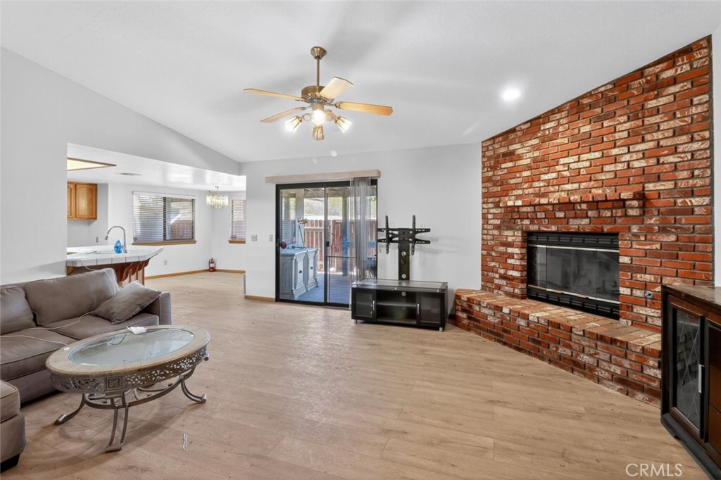 18539 Symeron Road Apple Valley, CA 92307 - Photo 11 of 30 a living room with furniture and a fireplace