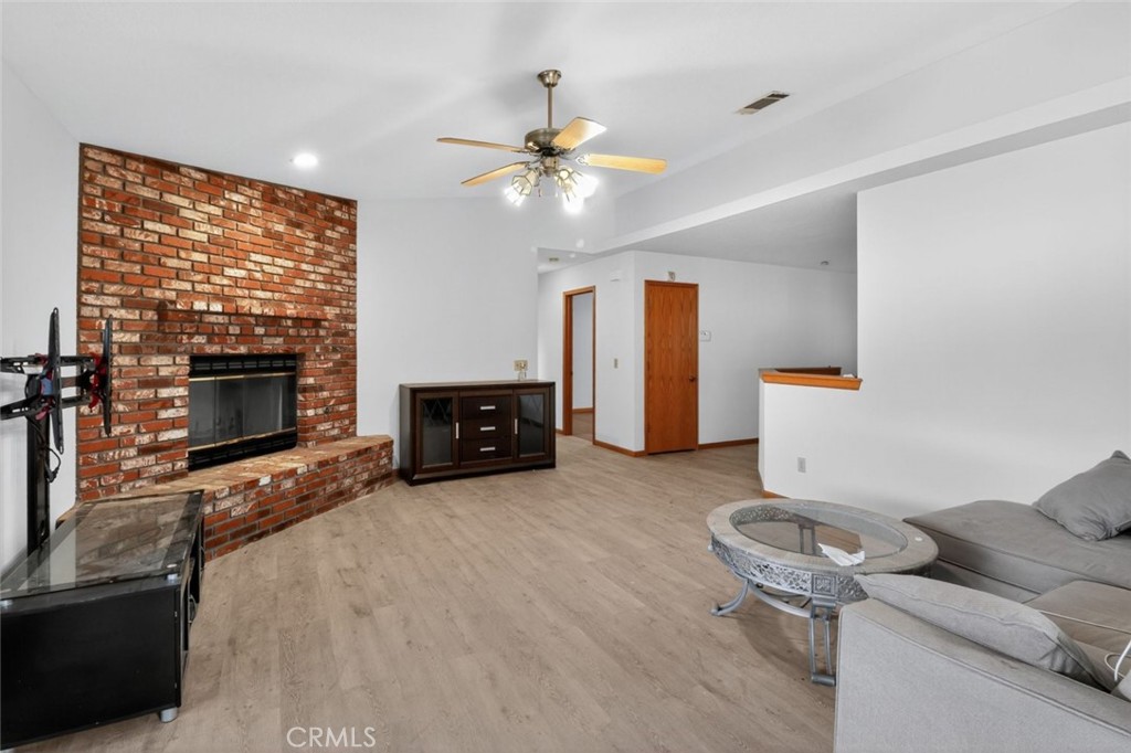 18539 Symeron Road Apple Valley, CA 92307 - Photo 13 of 30 a living room with furniture and a fireplace