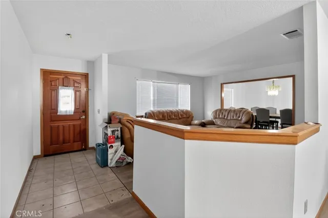 a view of living room with furniture and a window