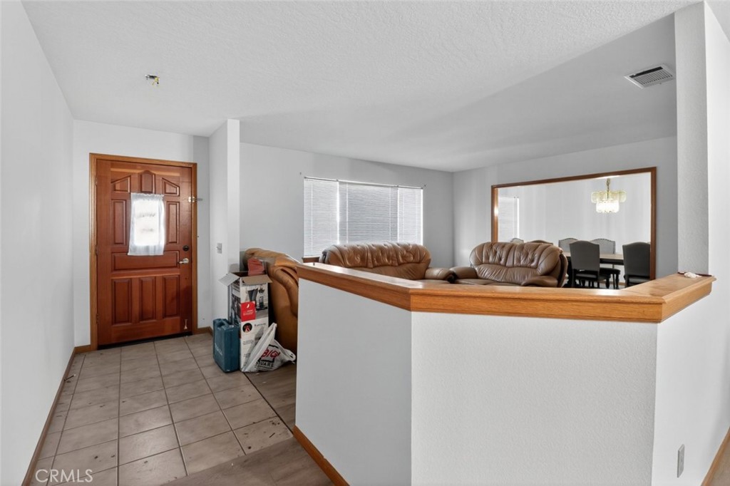 18539 Symeron Road Apple Valley, CA 92307 - Photo 17 of 30 a view of living room with furniture and a window