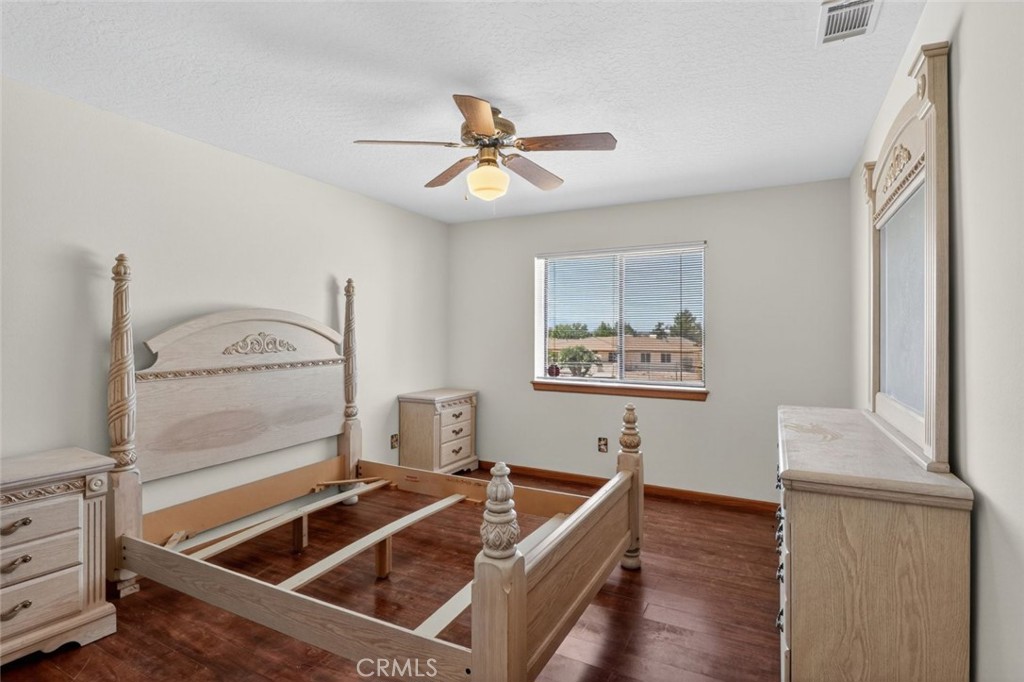 18539 Symeron Road Apple Valley, CA 92307 - Photo 21 of 30 a room with furniture and window