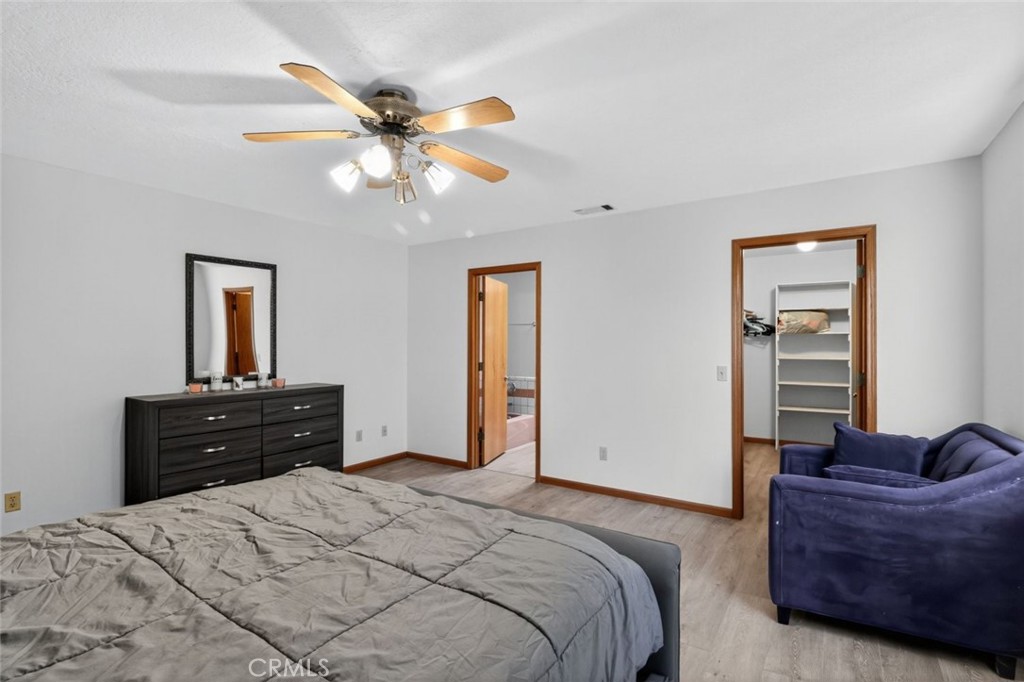 18539 Symeron Road Apple Valley, CA 92307 - Photo 24 of 30 a bedroom with a bed and window