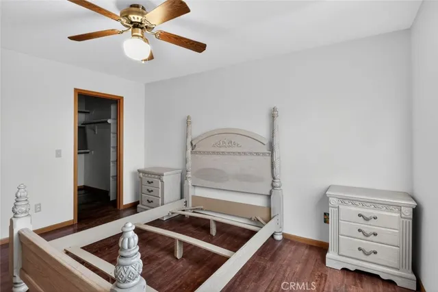 a room with furniture and ceiling fan