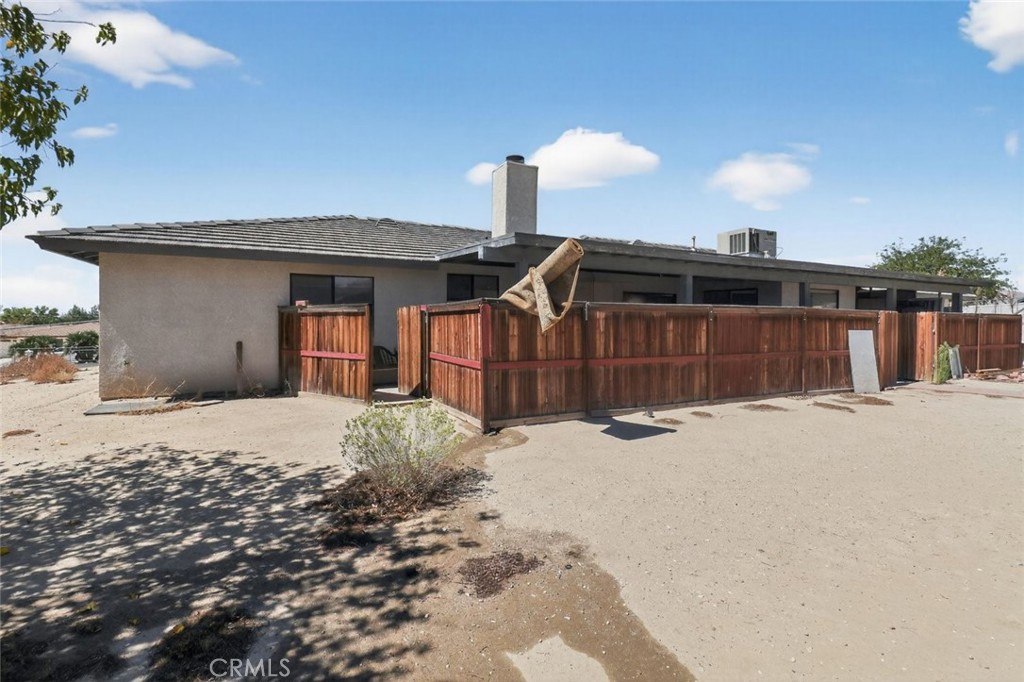 18539 Symeron Road Apple Valley, CA 92307 - Photo 8 of 30 a front view of a house with a yard