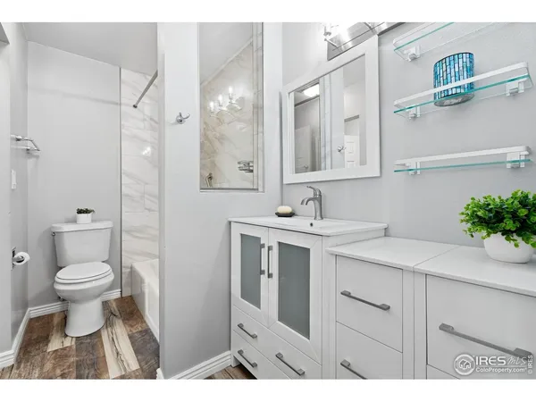 a bathroom with bathtub and shower