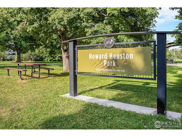 a view of grassy field with benches