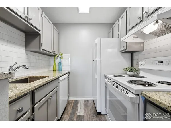 a kitchen with a sink a stove and refrigerator