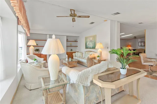 a kitchen with stainless steel appliances granite countertop a refrigerator and a stove