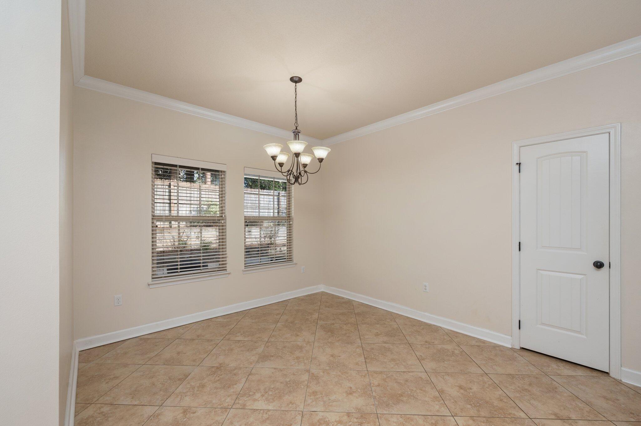 4434 Mirada Way Crestview, FL 32539 - Photo 19 of 42 a view of an empty room with a window