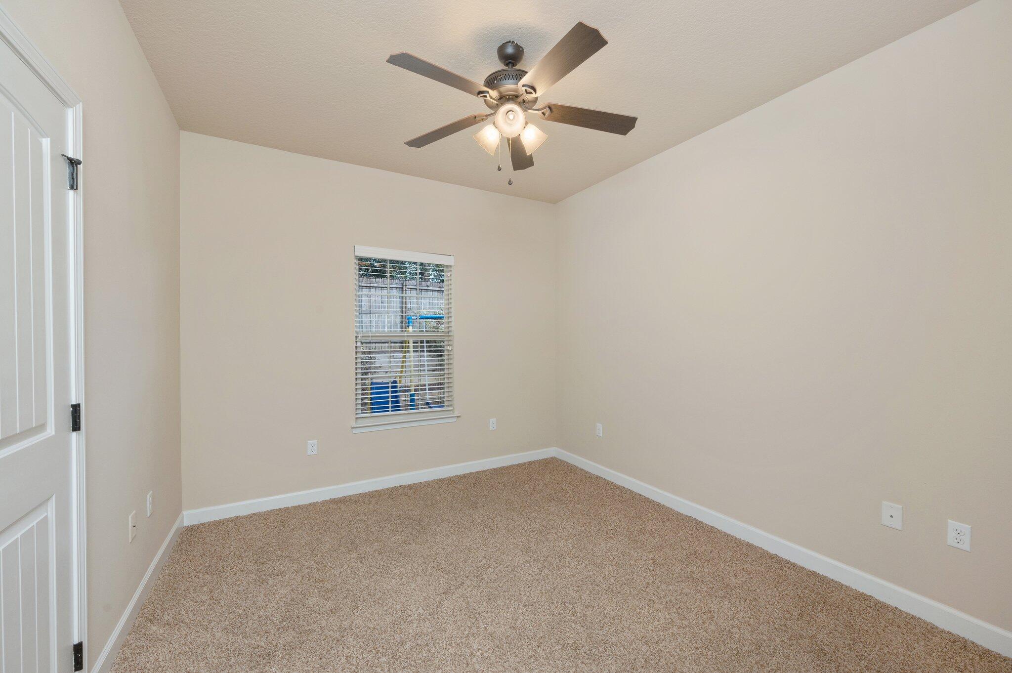 4434 Mirada Way Crestview, FL 32539 - Photo 28 of 42 a view of an empty room with a window