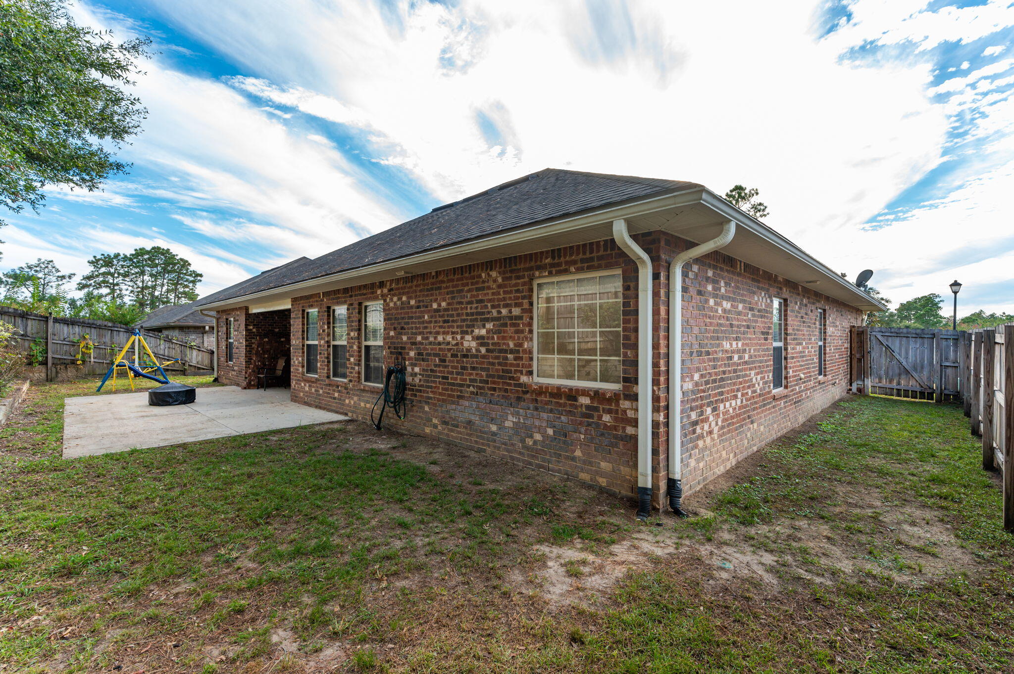 4434 Mirada Way Crestview, FL 32539 - Photo 39 of 42 a view of a house with backyard and porch