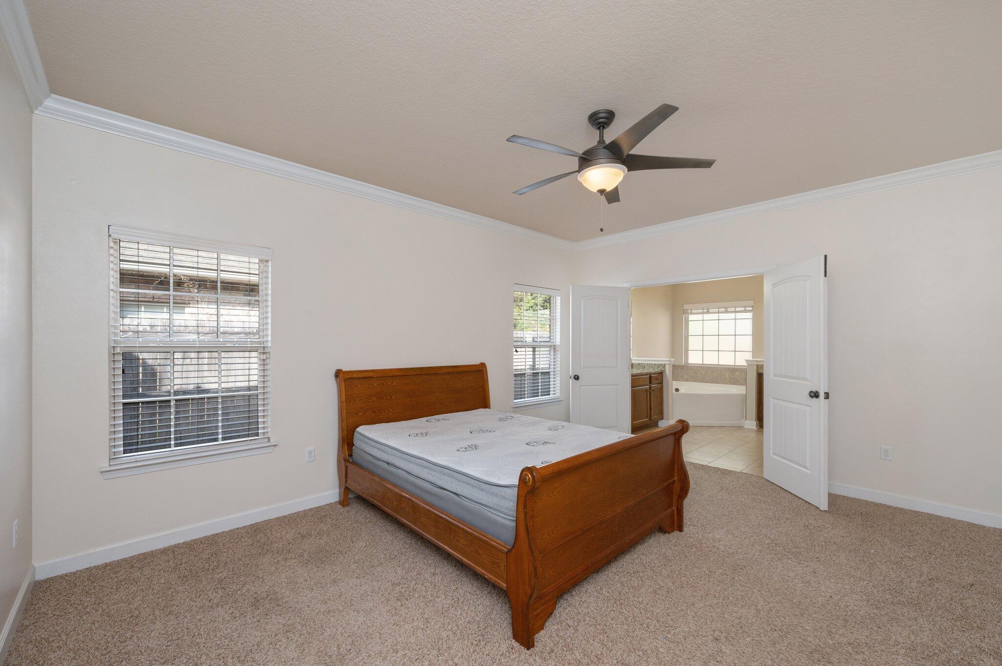 4434 Mirada Way Crestview, FL 32539 - Photo 7 of 42 a bedroom with a bed and window